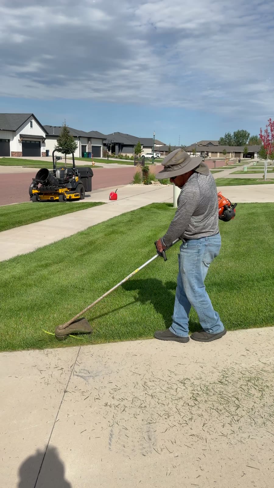 Kerwin crew precision-trimming a weekly mowing property in Sioux Falls