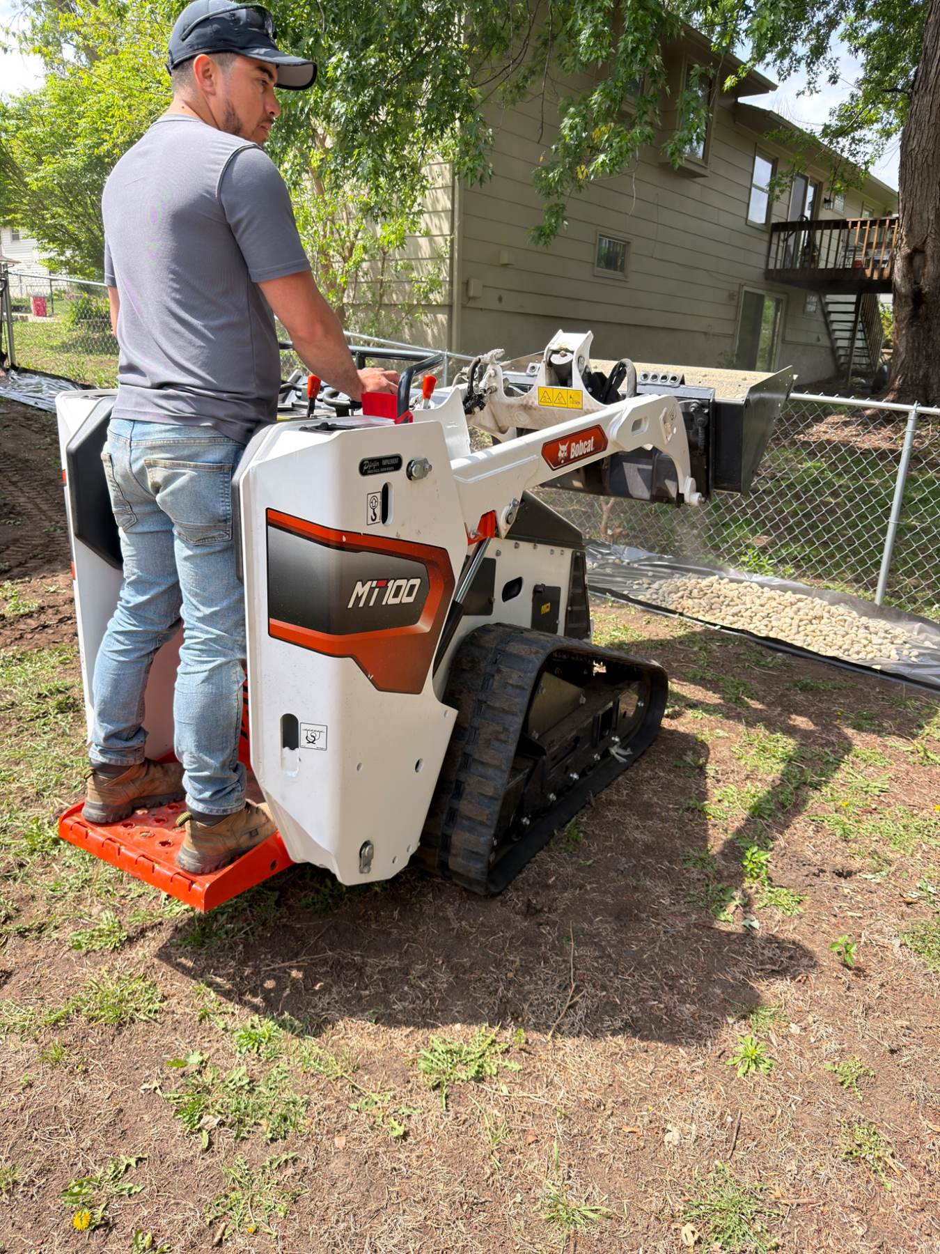 During — operator running a Bobcat MT100 mini skid steer on site